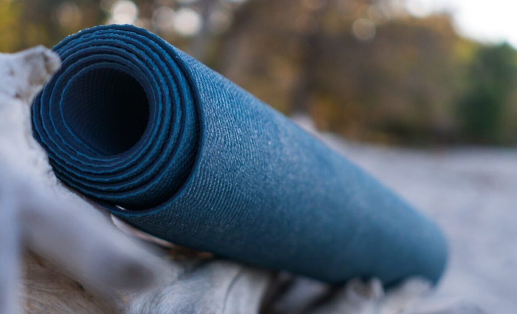 pilates exercise mat on beach