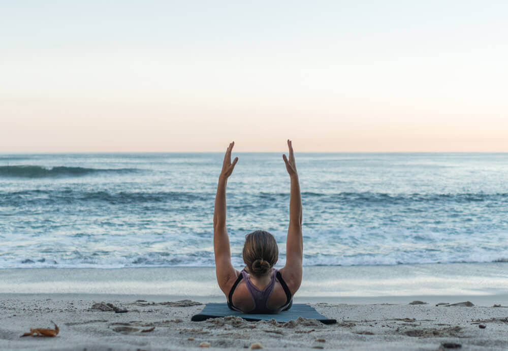 pilates exercise on beach