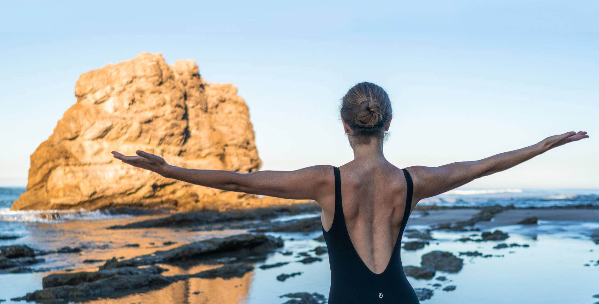 Pilates exercise by the ocean with Mav Wynn