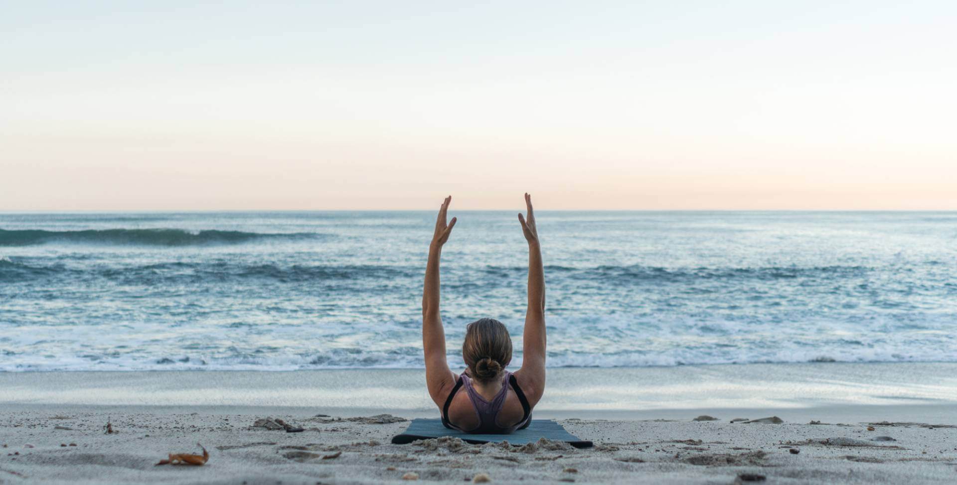 pilates exercise on beach